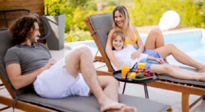 affordable pool renovation - family lounging beside pool